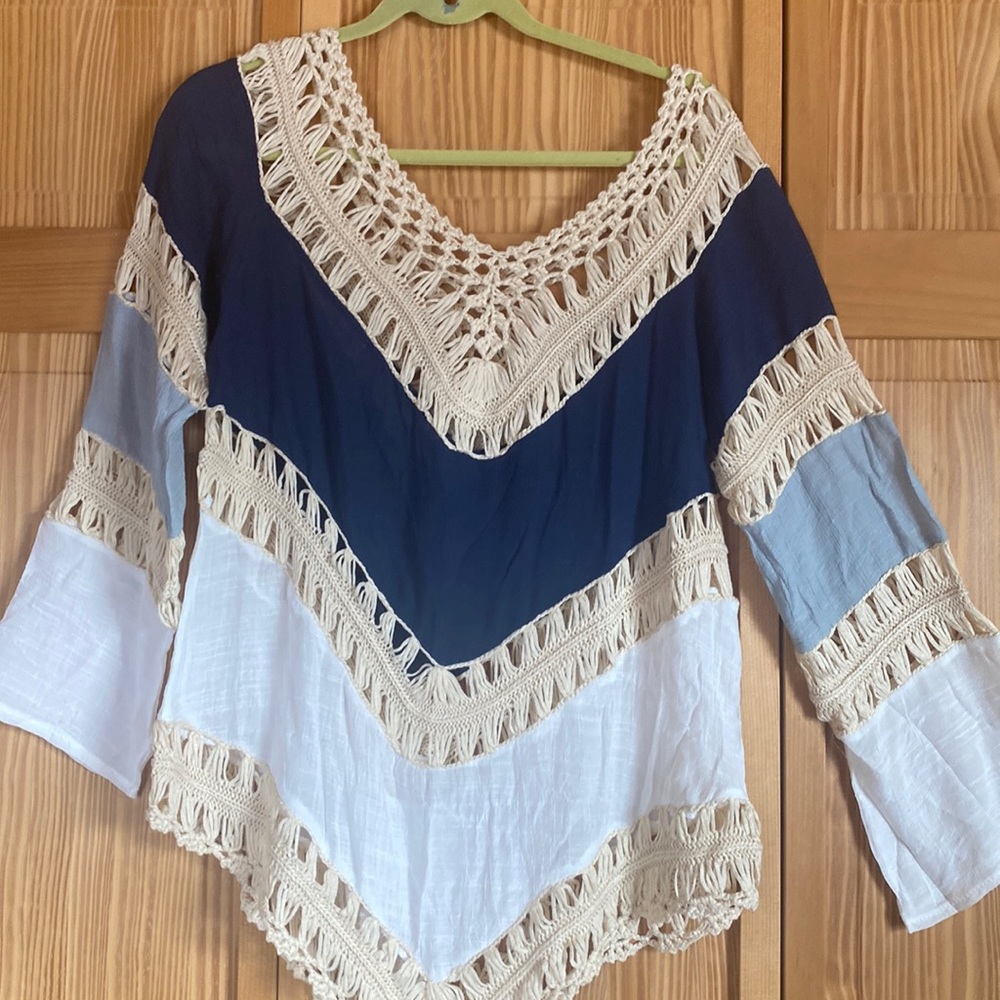 Navy & white w/crochet across neckline/parts of sleeves. measures 32”long/23”